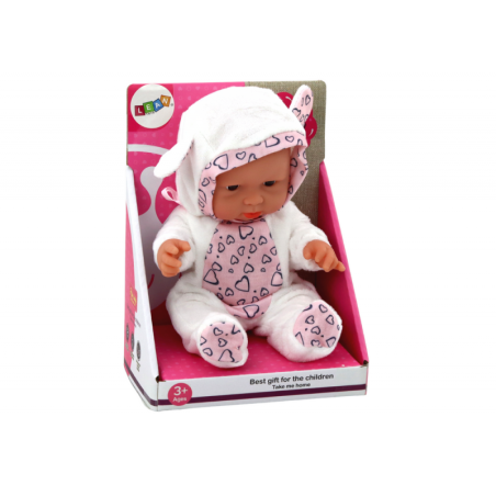 Väike beebinukk, valged riided, müts, vibu, kõrvad